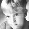 A young boy with blonde hair and blue eyes.